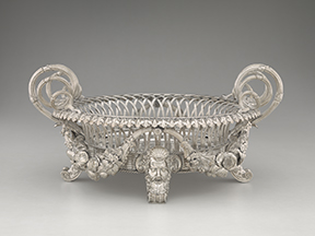 Obj. No. 2006.586	Photo No. 55145.CT.1
Paul Storr (British, 1771-1844)
Basket, 1813
Silver
9½”H x 20 5/16”W (handle to handle) x 16½”D
24.13 cm x 51.59 cm x 41.91 cm
Marks: sterling, London 1813/14; maker’s mark, Paul Storr; wt. 8458 g

Heraldry: Engraved arms of Wyndham quartering Hopton, borne by George, 3rd Earl of Egremont and his wife Elizabeth whom he married in 1801
Image must be credited with the following collection and photo credit lines:
Virginia Museum of Fine Arts, Richmond.  Gift of Rita R. Gans
Photo: Katherine Wetzel     © Virginia Museum of Fine Arts